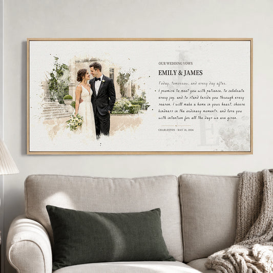 Custom photo and vows canvas in a natural walnut frame displayed above a neutral living room sofa.