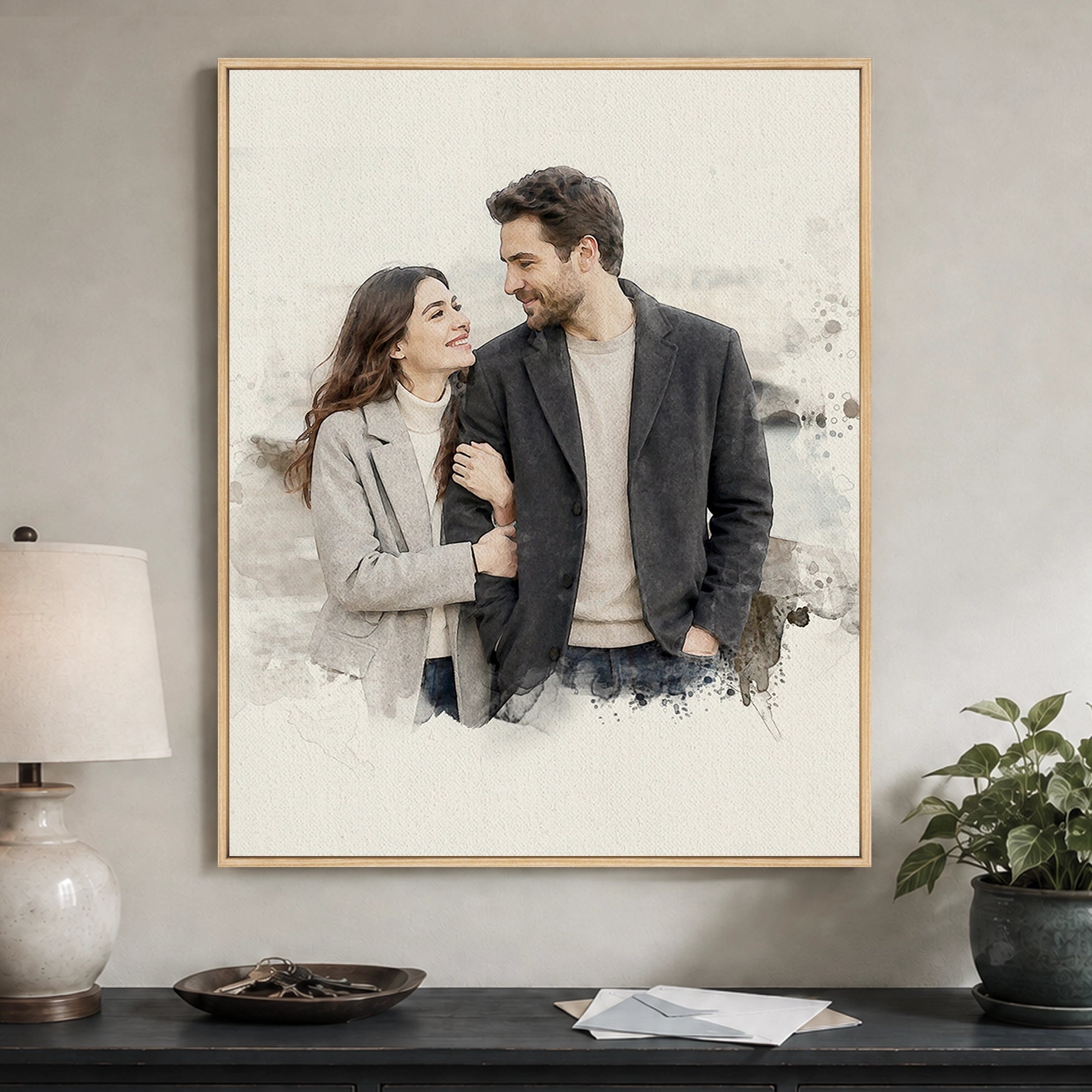 Custom watercolor portrait from a couple photo displayed as framed canvas wall art in a warm entryway.